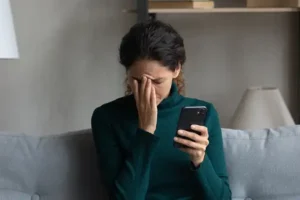 Woman face palming after insurance mistake