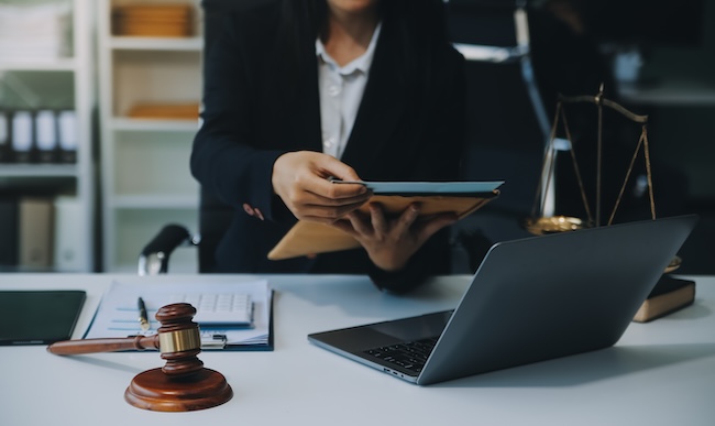 Personal injury attorney consulting with clients at Ross Moore Law office in Georgia and Tennessee