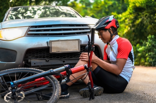A cyclist injured by a car and will now need help from an Atlanta bicycle accident lawyer at Ross Moore Law.