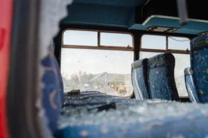 Destroyed bus interior with damaged seats and broken windows depicting bus crash attorney case aftermath.