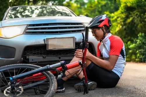 A cyclist injured by a car and will now need help from an Atlanta bicycle accident lawyer at Ross Moore Law.