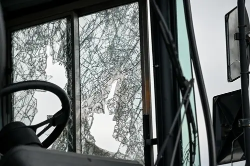Roswell attorney bus accident case showing a shattered bus windshield with severe spiderweb cracking from collision impact.